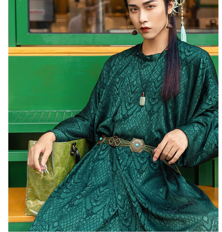 Elevate your style with our Tang Dynasty-inspired Round Collar Robe Hanfu. Crafted with attention to detail, this modern interpretation features a stylish round collar and half-arm design, perfect for men and women alike. Explore the timeless charm of ancient Chinese fashion with our green Hanfu ensemble.