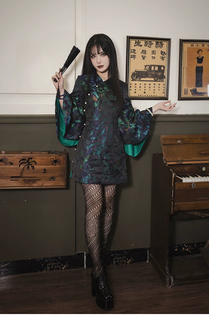 Black and green retro cheongsam dress featuring floral jacquard brocade, bell sleeves, and a slim fit. Made with a polyester, viscose, and cotton blend.