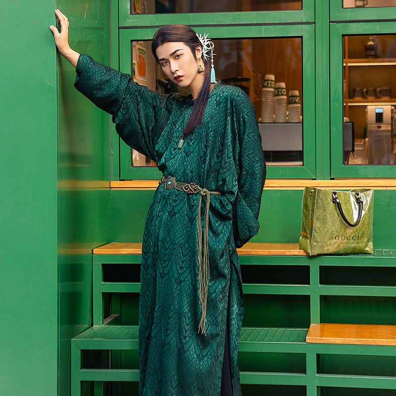 Elevate your style with our Tang Dynasty-inspired Round Collar Robe Hanfu. Crafted with attention to detail, this modern interpretation features a stylish round collar and half-arm design, perfect for men and women alike. Explore the timeless charm of ancient Chinese fashion with our green Hanfu ensemble.