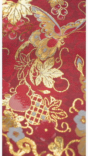 Gold embroidered butterfly and floral pattern on [Dan Que Acacia] New Chinese Style Red Wedding Dress fabric close-up.