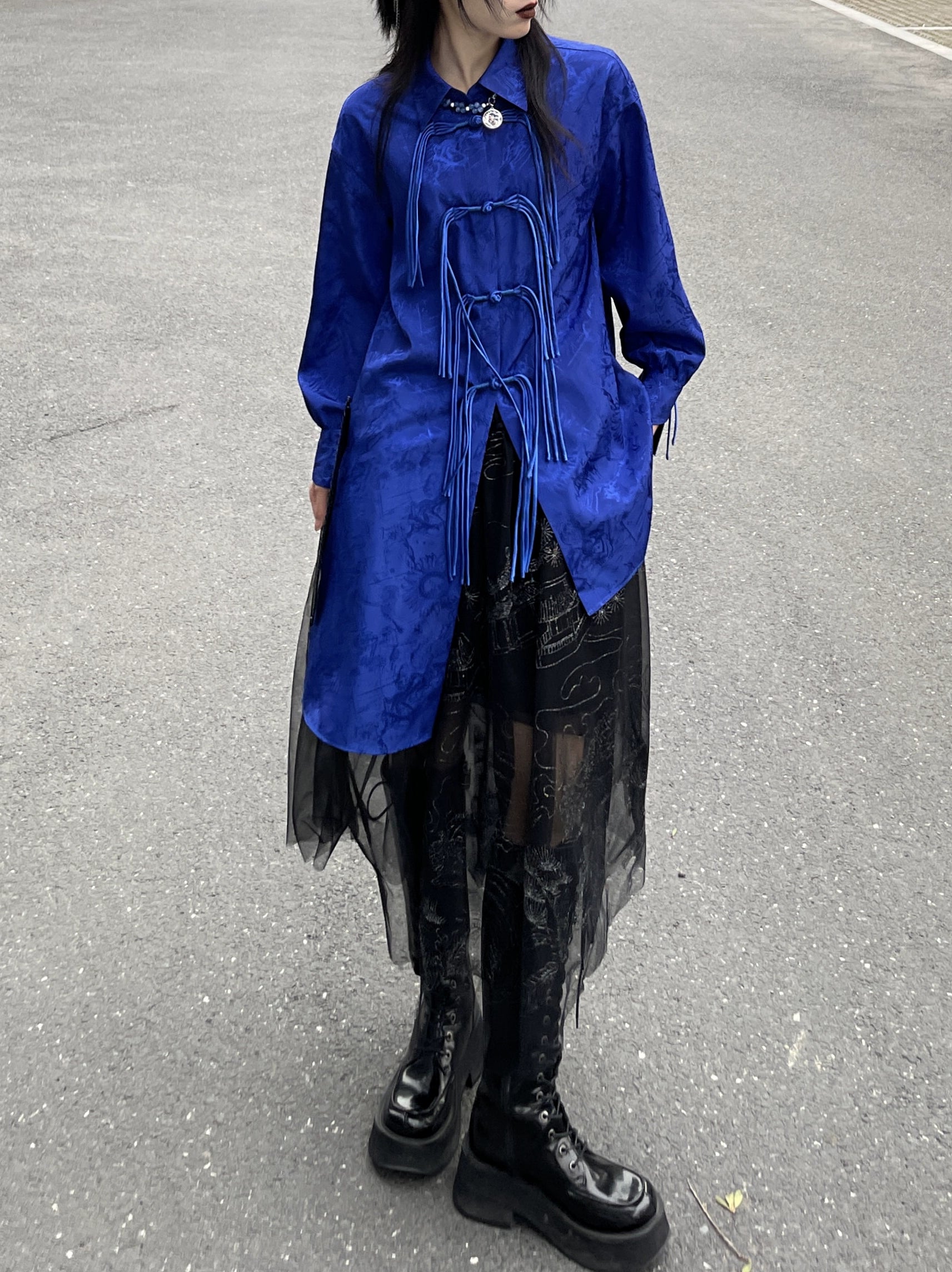 Elevate your style with our New Chinese Style Klein Blue Button-Down Shirt. This versatile piece exudes casual sophistication, perfect for any occasion. Inspired by traditional Hanfu craftsmanship, intricate embroidery adds a touch of elegance. Pair it with our black chiffon skirt for a stunning ensemble. Discover timeless style with our modern interpretation of classic elements.