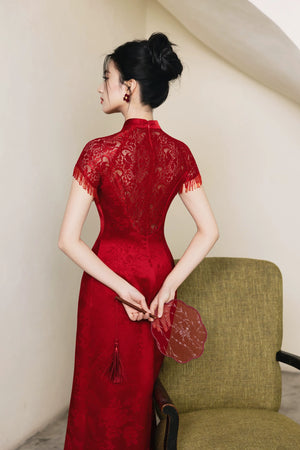 Back view of red lace-sleeve A-line cheongsam with round fan