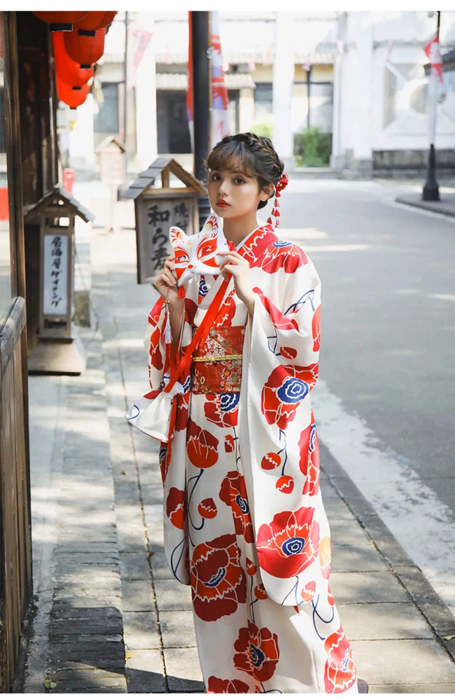 Close-up of the white fabric with red floral patterns from the Japanese kimono dress, highlighting the intricate artistic design.