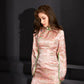 Short pink cheongsam with green accents and corrugated retro design.