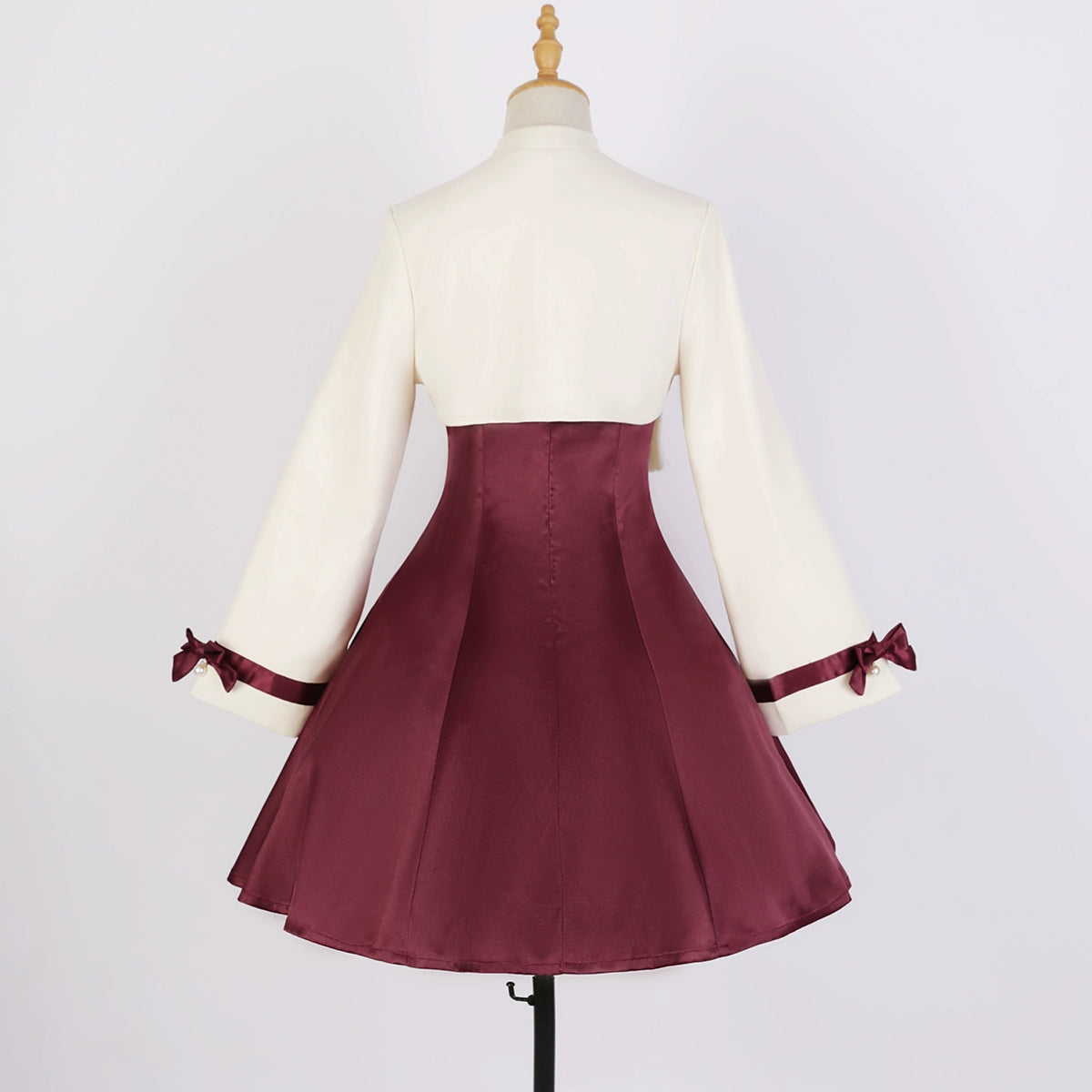 Back view of Camellia Lolita cheongsam dress showcasing cream top, burgundy skirt, and ribbon accents on sleeves.