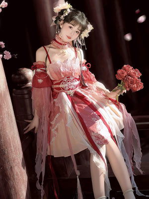 Seated model in Red Hanfu Dress New Chinese Feather Rust Waist Seal Suspender Skirt holding roses, highlighting layered skirt and waist seal.