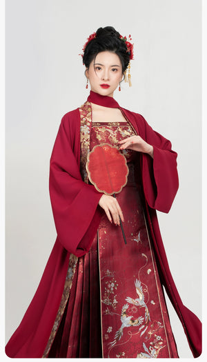 Model in [Dan Que Acacia] New Chinese Style Red Wedding Dress holding fan, highlighting neckline and bodice embroidery.