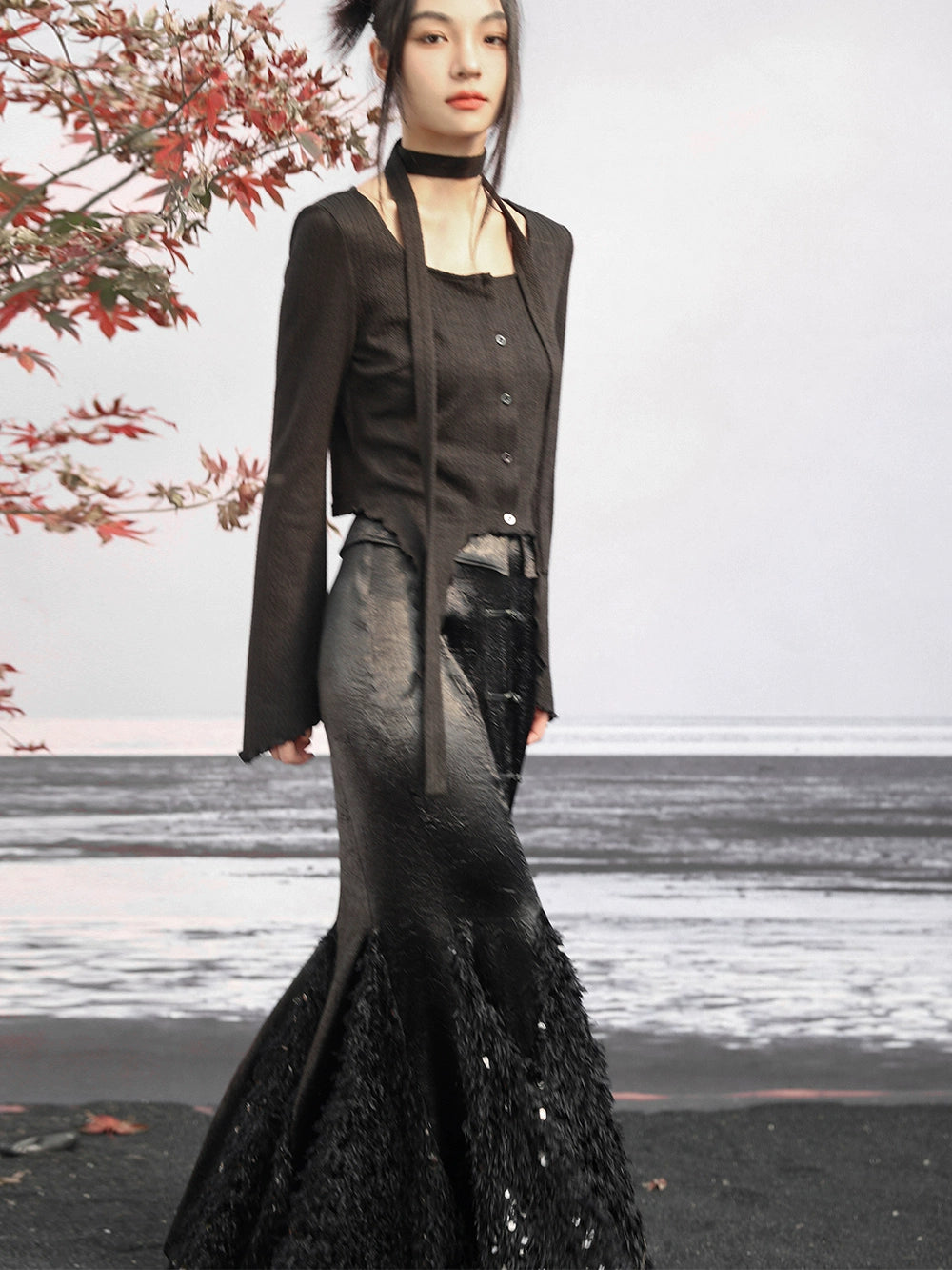 Step into sophistication with our New Chinese-inspired ensemble: a dark fishtail skirt paired elegantly with a black trumpet sweater top. Accentuated with sequined feather satin details, this ensemble exudes luxury and modern elegance. Explore our collection for timeless pieces that seamlessly blend classic Chinese style with contemporary design sensibilities.