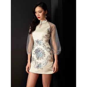 Elegant white jacquard cheongsam with floral embroidery and sheer polka-dot sleeves.