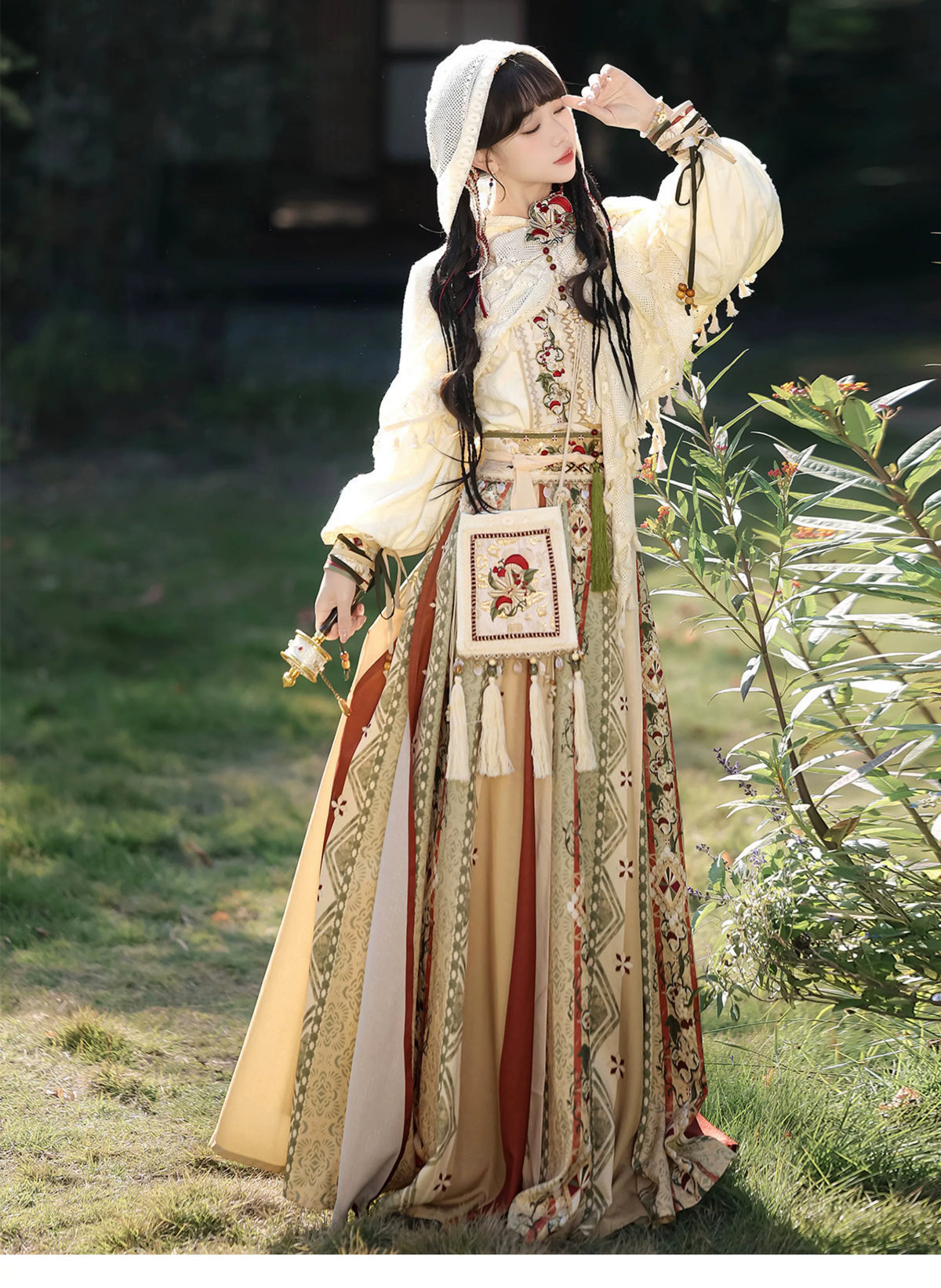 Hooded shawl worn over the full ivory outfit