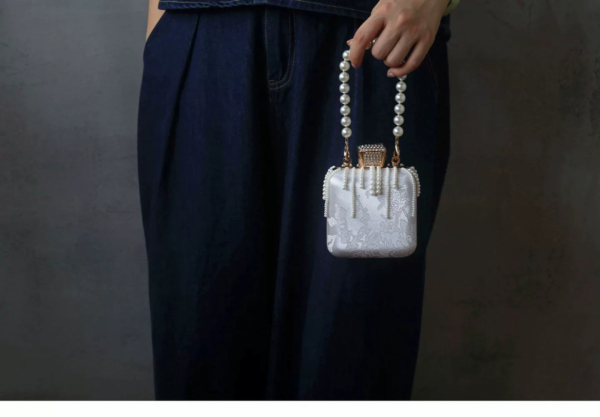 Full styling view showing the small scale of the handbag