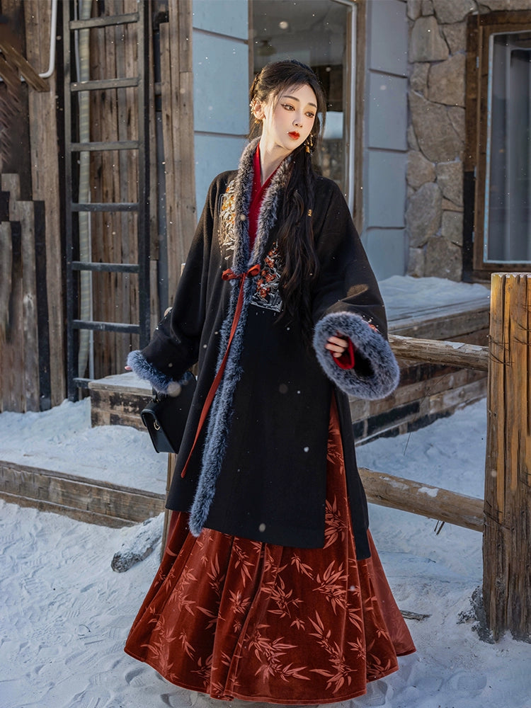 Black woolen Hanfu coat with floral embroidery and faux fur trim, paired with a red pleated skirt, ideal for autumn and winter.