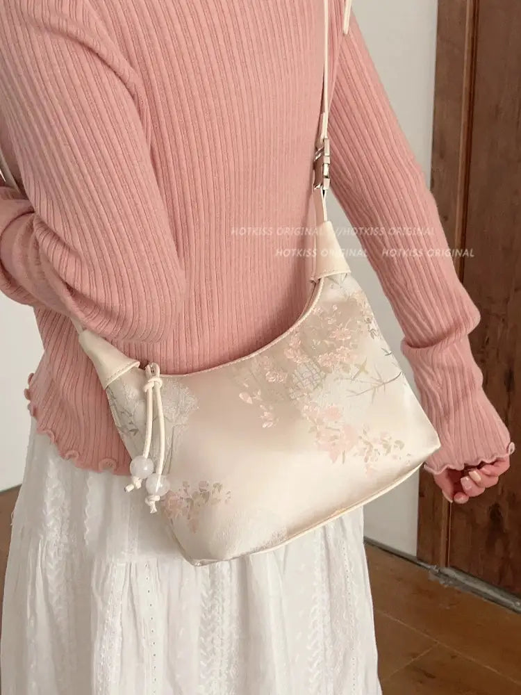 Complete your look with this elegant white cheongsam Bag, designed to complement both modern hanfu and traditional hanfu styles. Perfect for hanfu women, this bag adds charm to casual hanfu, hanfu cosplay, or layered hanfu outfits. A must-have hanfu accessory, it’s ideal for carrying essentials while maintaining an authentic style. Wondering where to buy qipao or accessories? Shop now at our trusted hanfu shop for the best modernised hanfu bags.