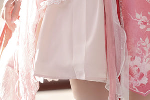 Close-up of skirt hem on Red Hanfu Dress New Chinese Feather Rust Waist Seal Suspender Skirt showing sheer and solid fabric layers.