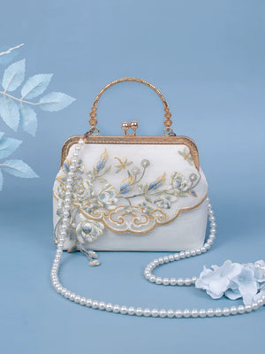 Yuejian Hanfu bag adorned with floral embroidery, gold-tone frame, and pearl strap, ideal for cultural and formal occasions.