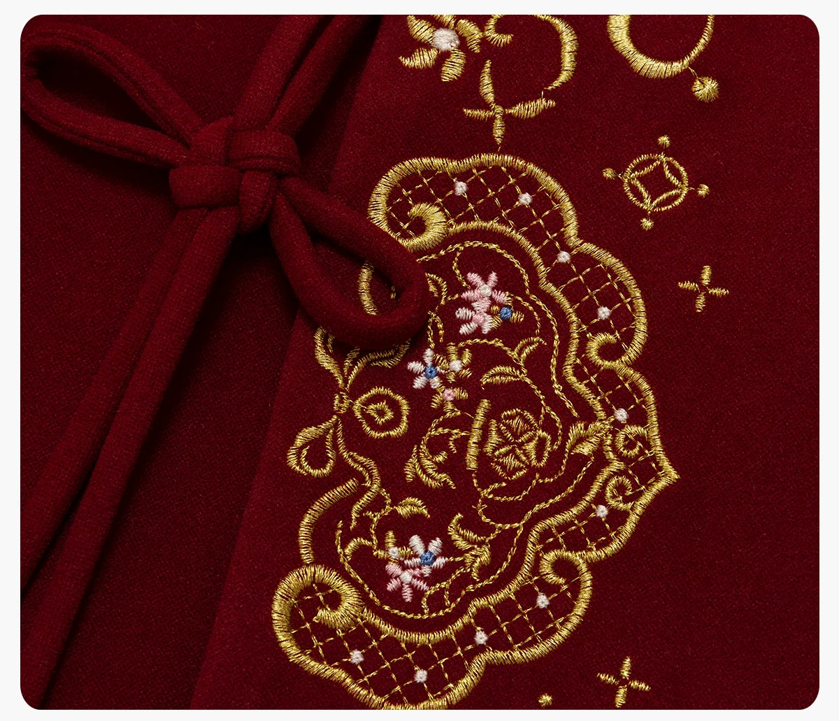 Red coat embroidery and knot fastening close-up