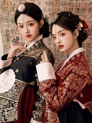 Close-up of Yanji hanbok dresses with detailed gold embroidery and accessories.