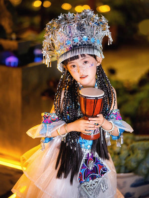 Xinjiang girls' ethnic performance outfit in Miao Purple with traditional drum, silver accessories, and layered white skirt for stage shows.
