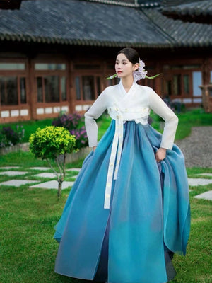 Blue Hanbok 2025 new princess palace wedding clothing featuring a flowing layered skirt and floral hairpiece, ideal for traditional performances.