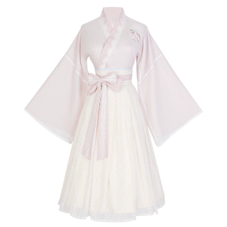 Flat lay of Pink Modern Hanfu Dress with embroidered top and lace skirt, showcasing traditional Chinese design with modern elegance.