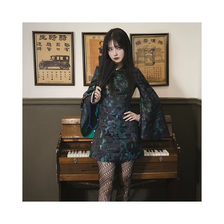 Black and green cheongsam dress with floral jacquard brocade, bell sleeves, and a glossy finish. Made with non-elastic polyester, viscose, and cotton.