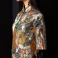 Side profile of cheongsam dress with detailed jacquard floral design.