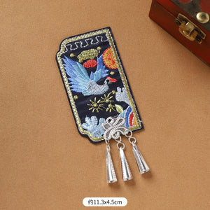 Single Guizhou Miao fridge magnet with blue bird embroidery and silver cone fringe, 11.3x4.5cm, handmade ethnic decor.