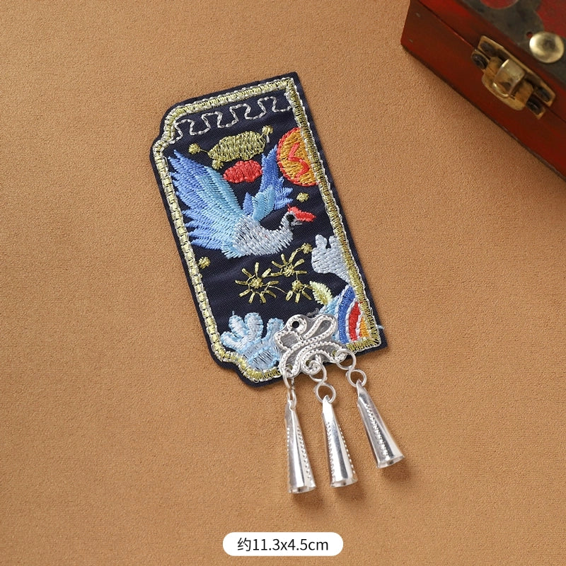 Single Guizhou Miao fridge magnet with blue bird embroidery and silver cone fringe, 11.3x4.5cm, handmade ethnic decor.