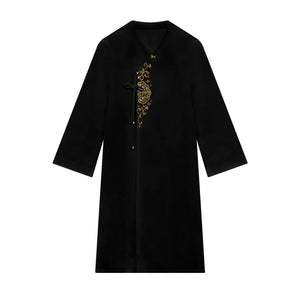 Black floral coat displayed alone