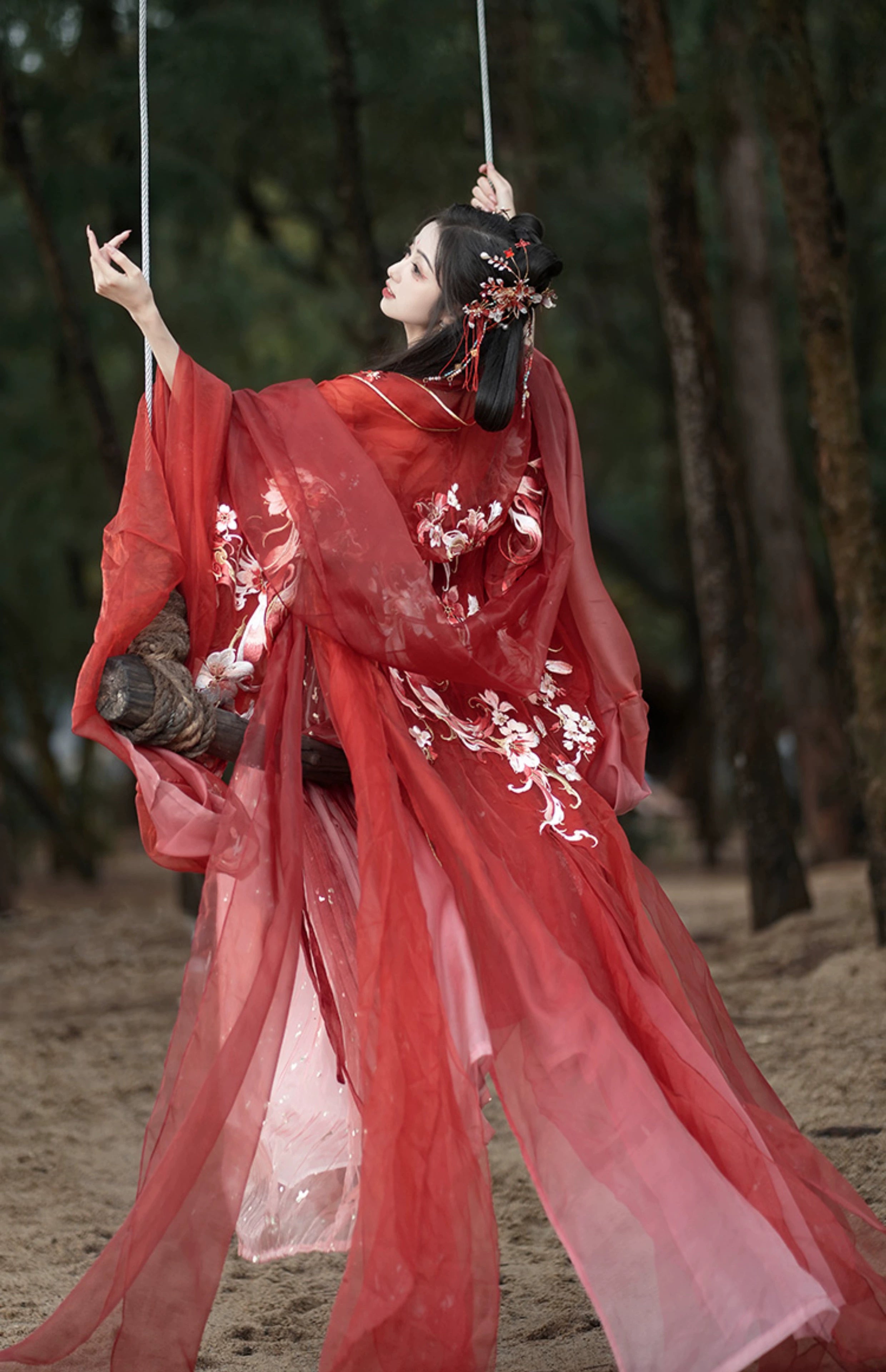 Step into the opulent world of Tang Dynasty elegance with our exquisite Red Hanfu Ensemble. Featuring a chest-length wrap skirt adorned with intricate super fairy embroidery and paired with a flowing large-sleeved top suit, our ensemble captures the essence of Tang Dynasty grandeur and sophistication. Embrace the rich heritage and timeless beauty of ancient Chinese fashion with our stunning collection.