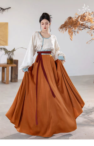 This orange modern hanfu features elegant hanfu sleeves, a stylish hanfu jacket, and timeless Ming Dynasty hanfu charm. Perfect as a princess hanfu dress, fairy hanfu dress, or casual hanfu, it’s great for hanfu cosplay or as a warm winter hanfu. Pair with a hanfu shirt or wear it as a modern hanfu dress. Shop authentic orange hanfu at our trusted hanfu shop, offering modernised hanfu and styles from the best Chinese designer clothing websites and modern Chinese clothes collections.