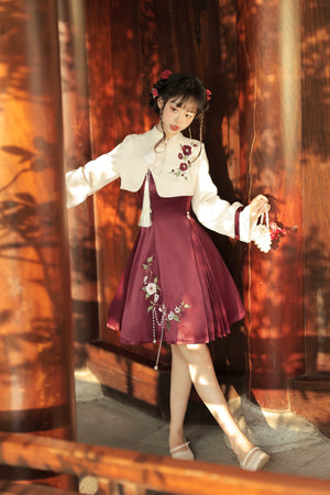 Stylish Lolita cheongsam dress with cream top, burgundy skirt, floral embroidery, and ribbon accents on sleeves.