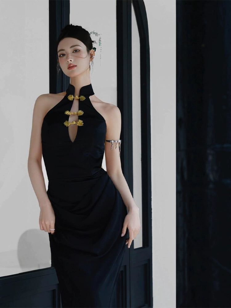 Sophisticated black fishtail cheongsam dress with gold floral details, styled for a modern and elegant look.