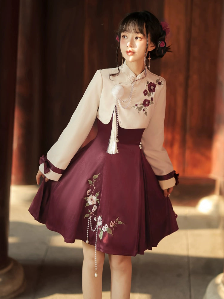 Modern Lolita cheongsam dress with intricate floral embroidery, pleated burgundy skirt, and cream top with ribbon accents.