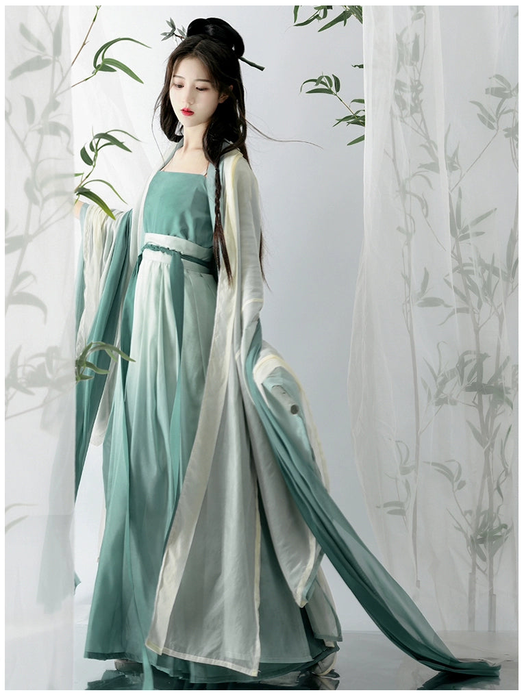 Elevate your style with our Hanfu Women's Green Daily Long Gown Wrap Skirt, inspired by the majestic beauty of the Song Dynasty. Explore our collection featuring Song Dynasty Hanfu, Hanfu skirts, and Hanfu shirts. Discover casual and princess-inspired Hanfu outfits, complemented by Dunhuang-inspired designs. Experience the allure of traditional Hanfu fashion with vibrant green hues and exquisite detailing.
