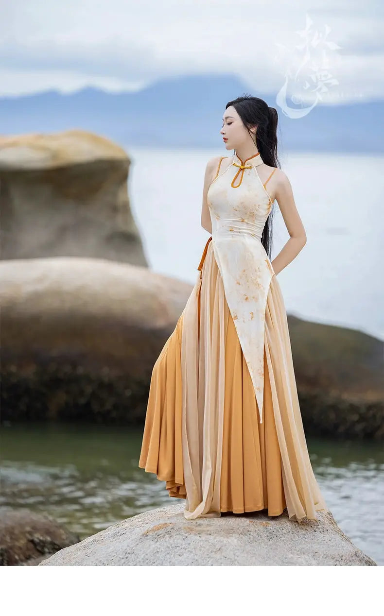 Model in cheongsam dress standing on a rock by the sea