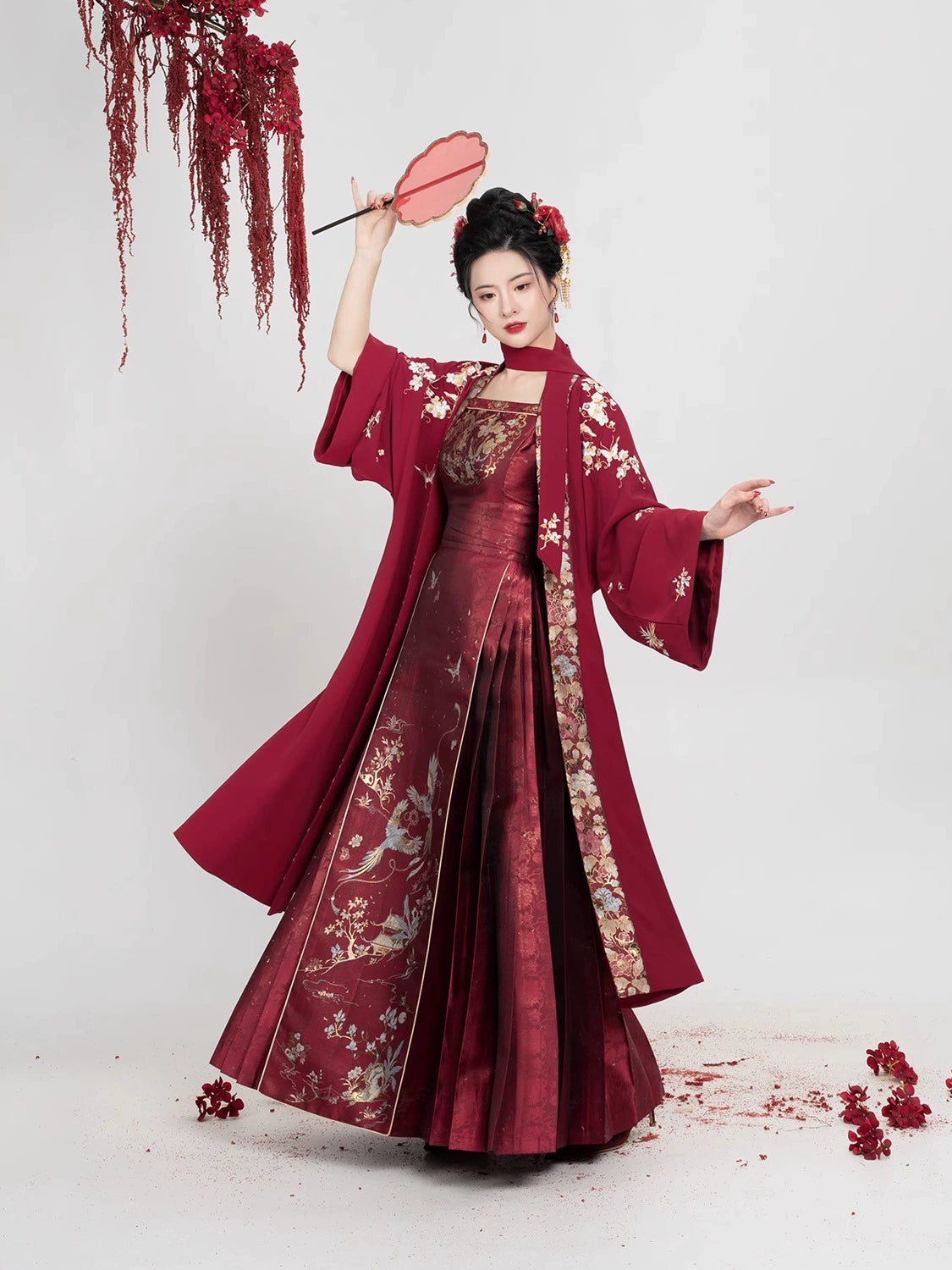 Model twirling in [Dan Que Acacia] New Chinese Style Red Wedding Dress, emphasizing movement and traditional elegance.