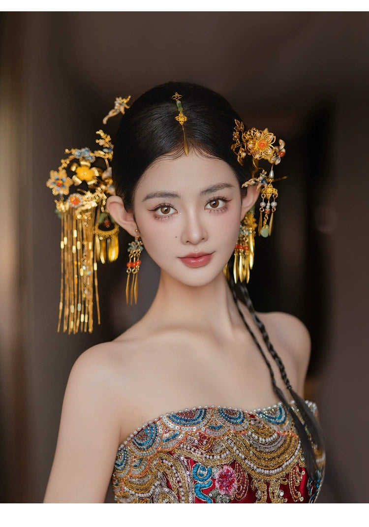 Smiling bride wearing antique Chinese butterfly tassel hairpin, styled with intricate gold floral and tassel elements.