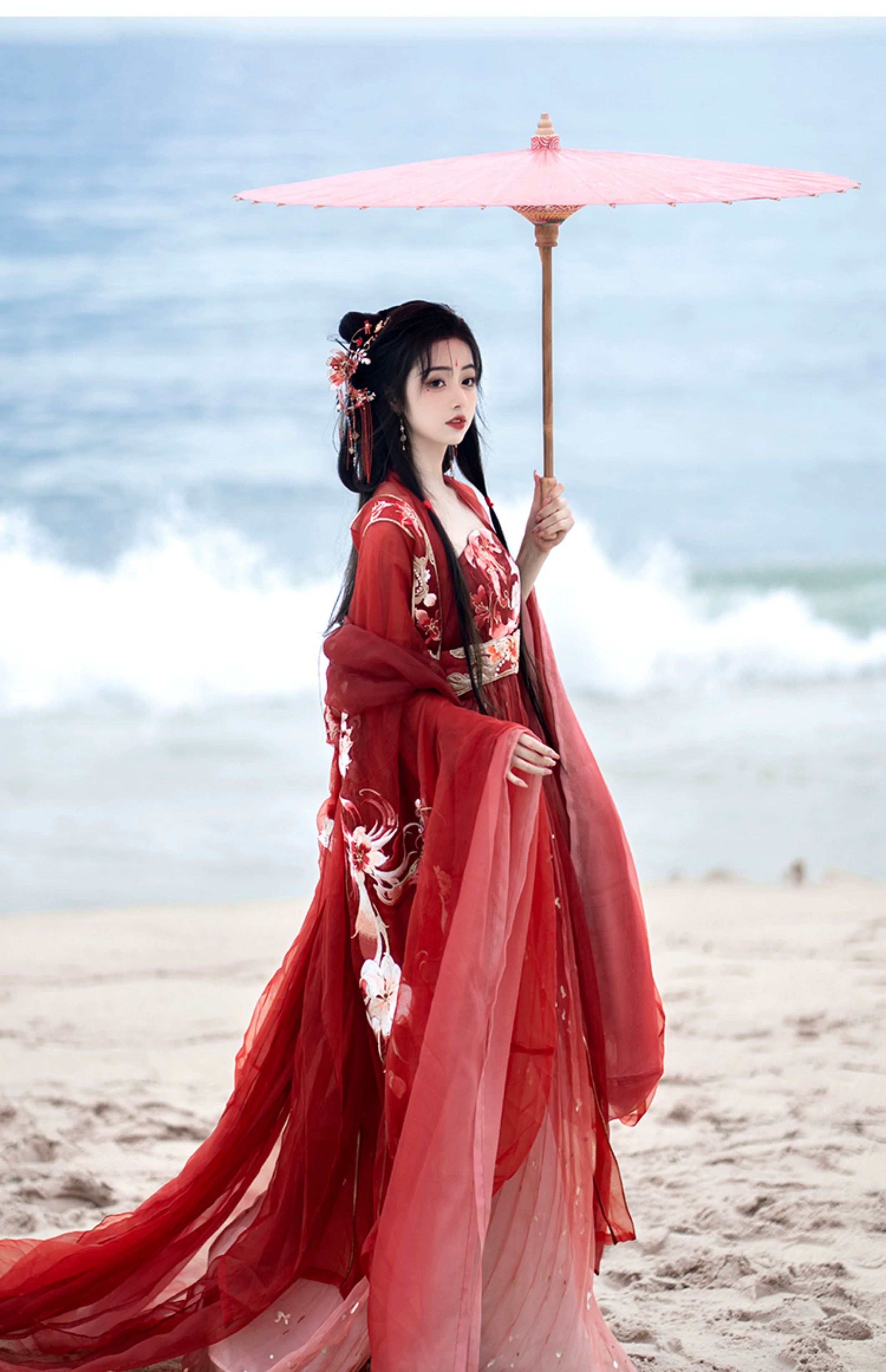 Step into the opulent world of Tang Dynasty elegance with our exquisite Red Hanfu Ensemble. Featuring a chest-length wrap skirt adorned with intricate super fairy embroidery and paired with a flowing large-sleeved top suit, our ensemble captures the essence of Tang Dynasty grandeur and sophistication. Embrace the rich heritage and timeless beauty of ancient Chinese fashion with our stunning collection.