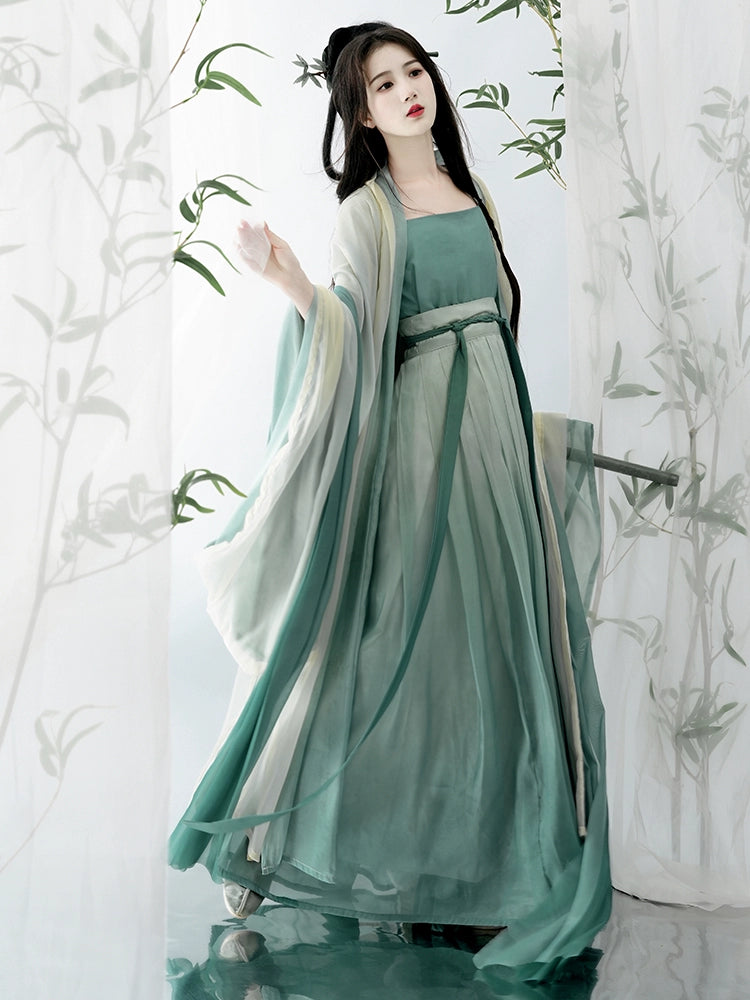 Elevate your style with our Hanfu Women's Green Daily Long Gown Wrap Skirt, inspired by the majestic beauty of the Song Dynasty. Explore our collection featuring Song Dynasty Hanfu, Hanfu skirts, and Hanfu shirts. Discover casual and princess-inspired Hanfu outfits, complemented by Dunhuang-inspired designs. Experience the allure of traditional Hanfu fashion with vibrant green hues and exquisite detailing.