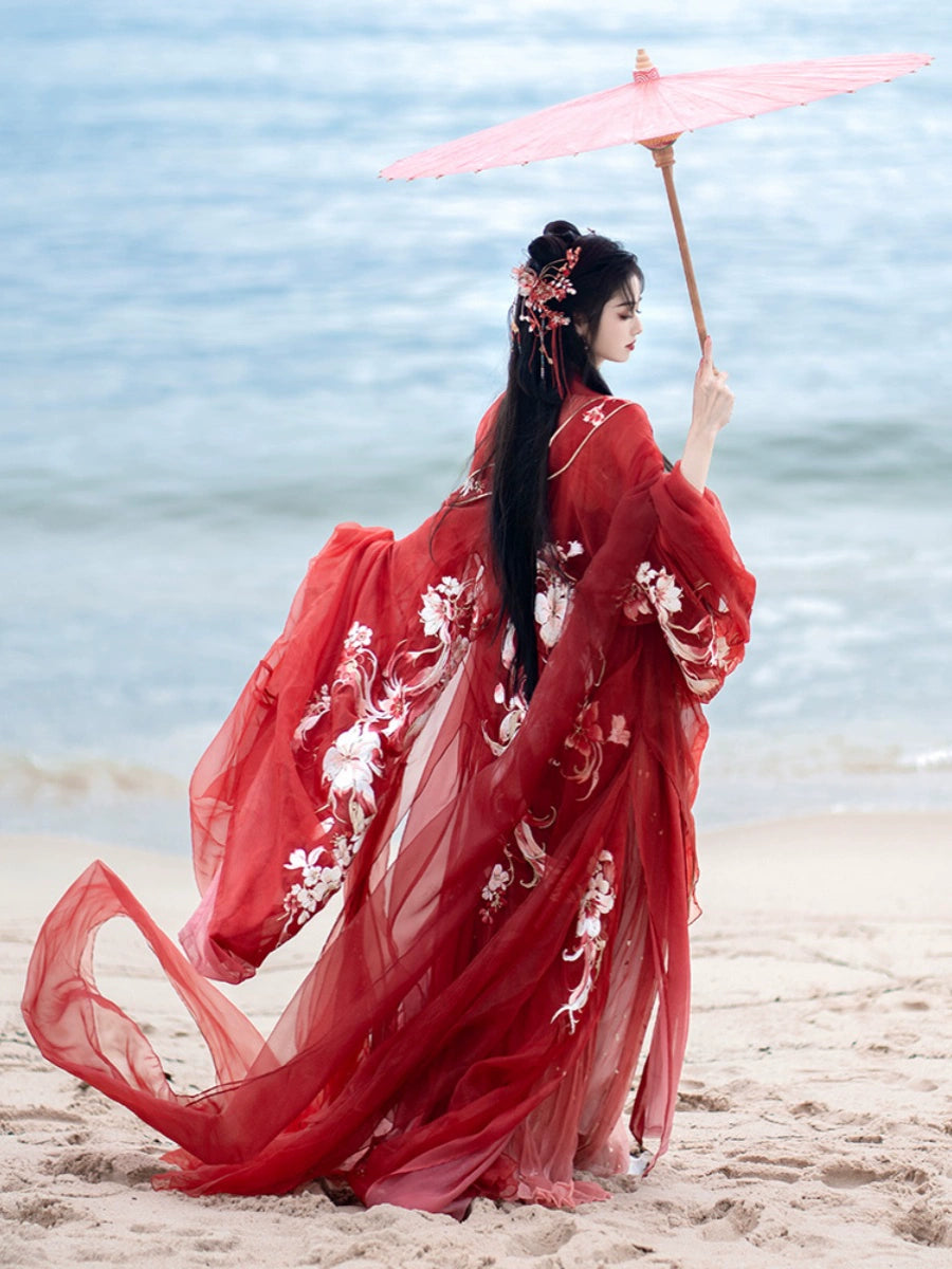 Step into the opulent world of Tang Dynasty elegance with our exquisite Red Hanfu Ensemble. Featuring a chest-length wrap skirt adorned with intricate super fairy embroidery and paired with a flowing large-sleeved top suit, our ensemble captures the essence of Tang Dynasty grandeur and sophistication. Embrace the rich heritage and timeless beauty of ancient Chinese fashion with our stunning collection.