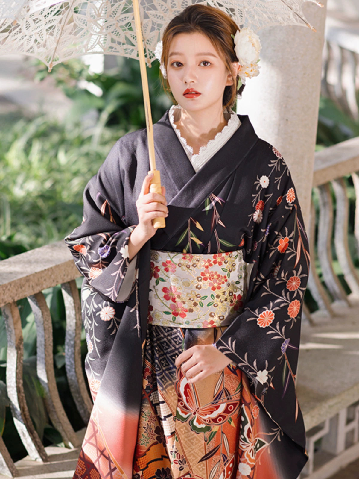 Retro Japanese kimono with intricate butterfly and floral designs, styled with a parasol.