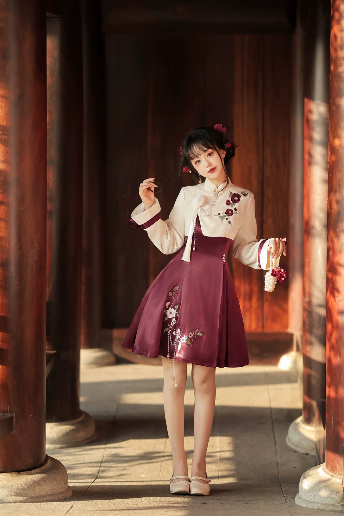 Elegant Chinese-style Lolita cheongsam with floral embroidery, cream top, burgundy skirt, and ribbon details on sleeves.