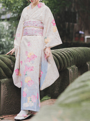 White retro Japanese kimono with pink and yellow floral designs, styled with a matching obi.