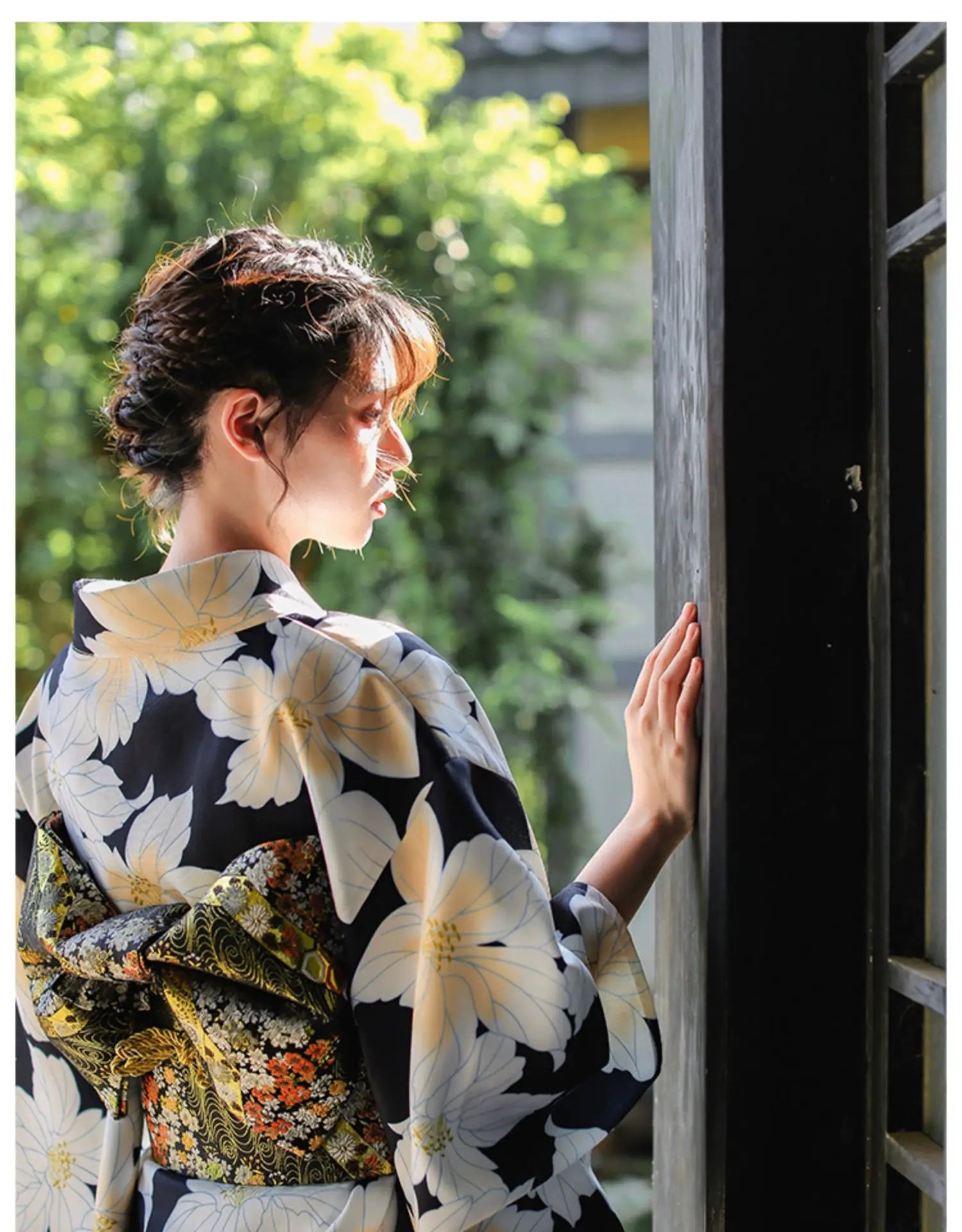 Rear view of a Japanese kimono dress with a floral pattern and intricate obi belt, styled for traditional festivals and events.