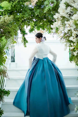 Rear view of Blue Hanbok 2025 new princess palace wedding clothing with pleated skirt and classic white top, ideal for formal events.