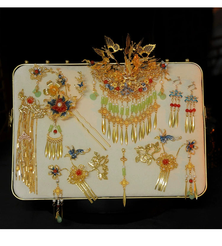 Display of Chinese bridal butterfly tassel hairpin set with earrings and pins, featuring antique gold and colorful accents.