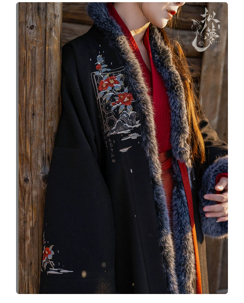 Flat-lay of white woolen Hanfu coat with floral embroidery, faux fur trim, and red ribbon ties, ideal for autumn and winter.