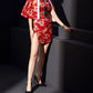 Red cheongsam dress with cape-style overlay and dragon totem print.