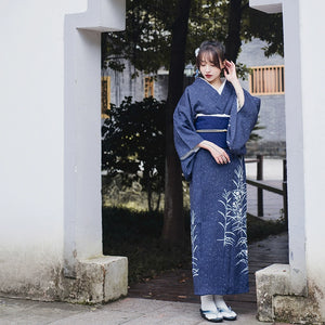 Full-length view of blue Japanese kimono yukata with white floral design.